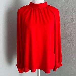 High neck orange blouse with balloon sleeves
